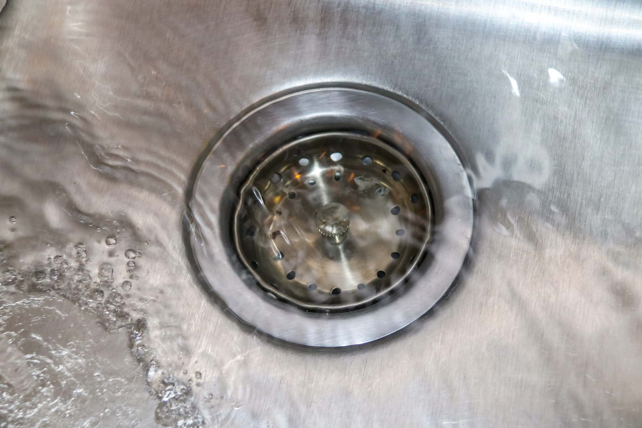 Water drains slowly, Clogged Drains.