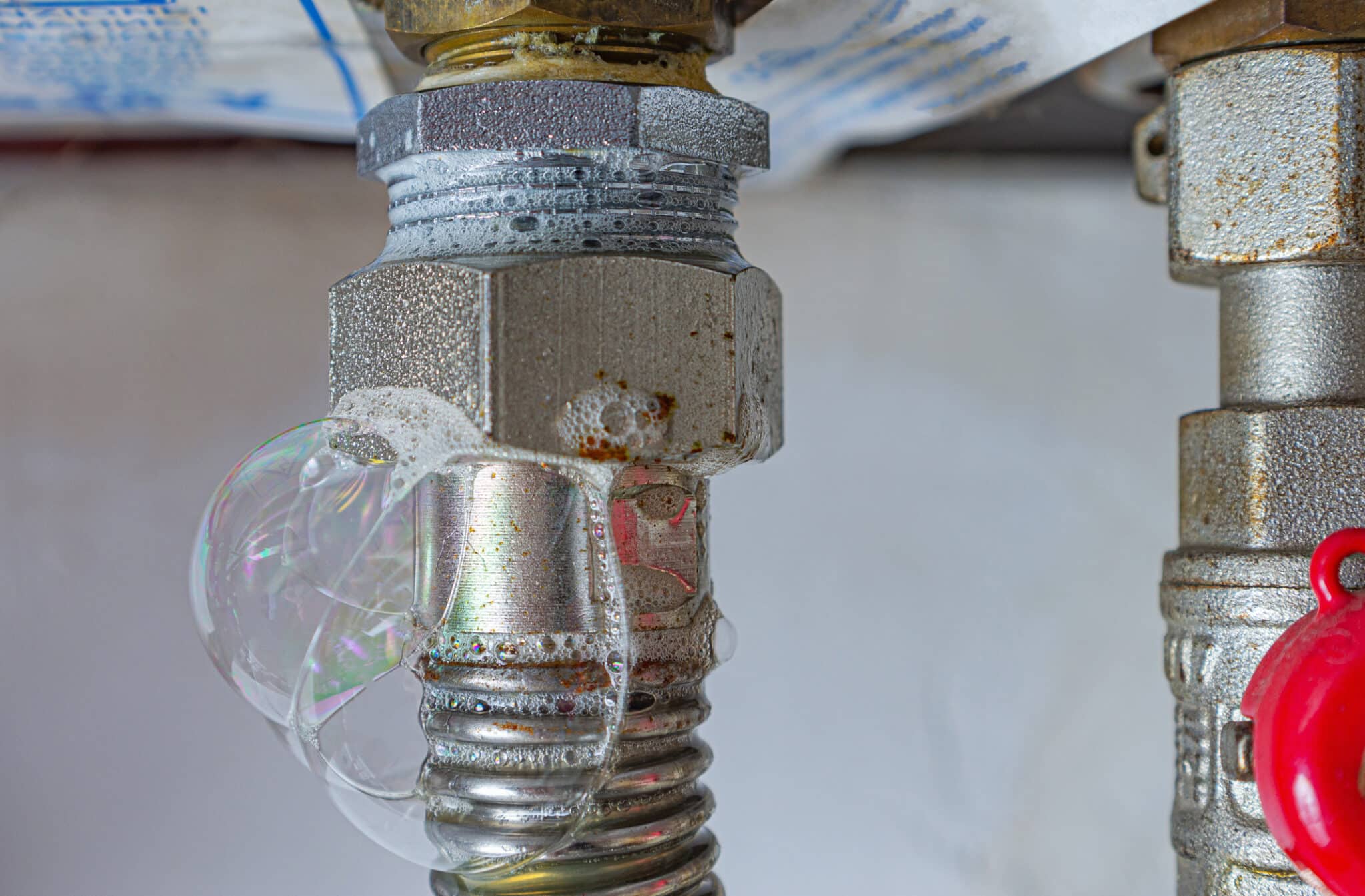 Gas leak at home heating boiler, showing signs your home may need gas line replacement.