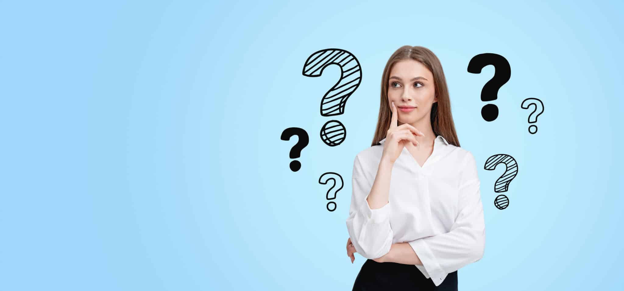 Woman on blue background with question marks, wondering what a sewer camera inspection reveals.